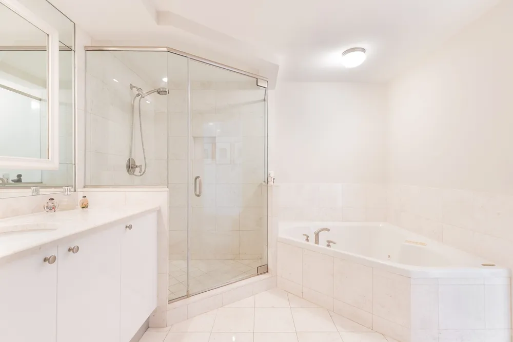 Bathroom remodel permit plans beside plumbing, electrical and tile installation work