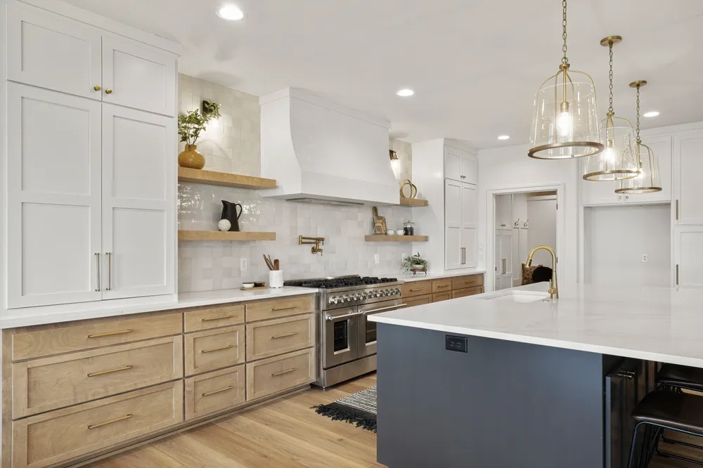 Remodeled Orange County kitchen with new cabinets, countertops, flooring, appliances and island lighting