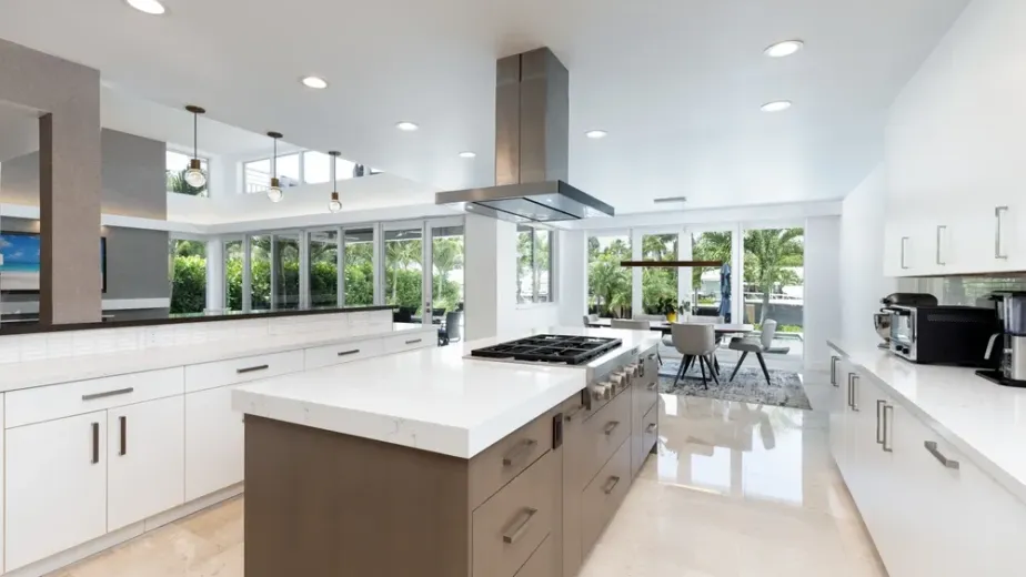 Remodeled Orange County kitchen with new cabinets, countertops, flooring, appliances and island lighting