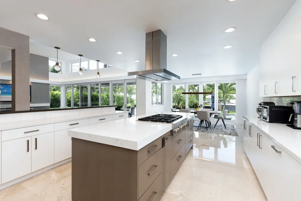 Remodeled Orange County kitchen with new cabinets, countertops, flooring, appliances and island lighting