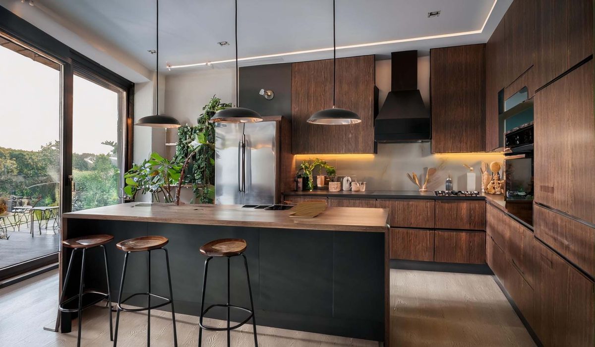 Stylish home kitchen interior with bar island and cabinet, refrigerator